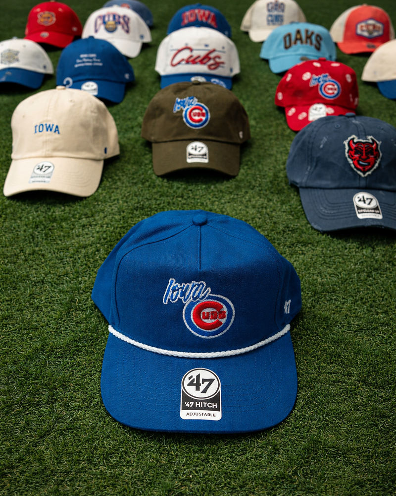 Iowa_Cubs_cap_on_vibrant_grass.png