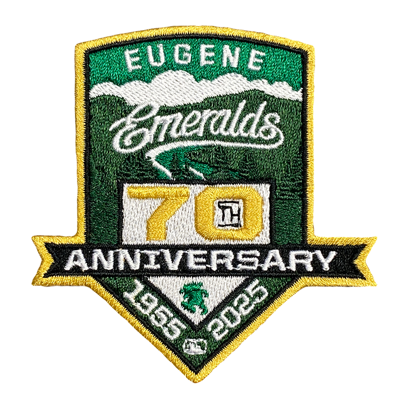 A logo patch celebrating the Eugene Emeralds 70th Anniversary, featuring green and gold colors with a diamond shape and the text 'Eugene Emeralds 70 ANNIVERSARY 1955-2025'.