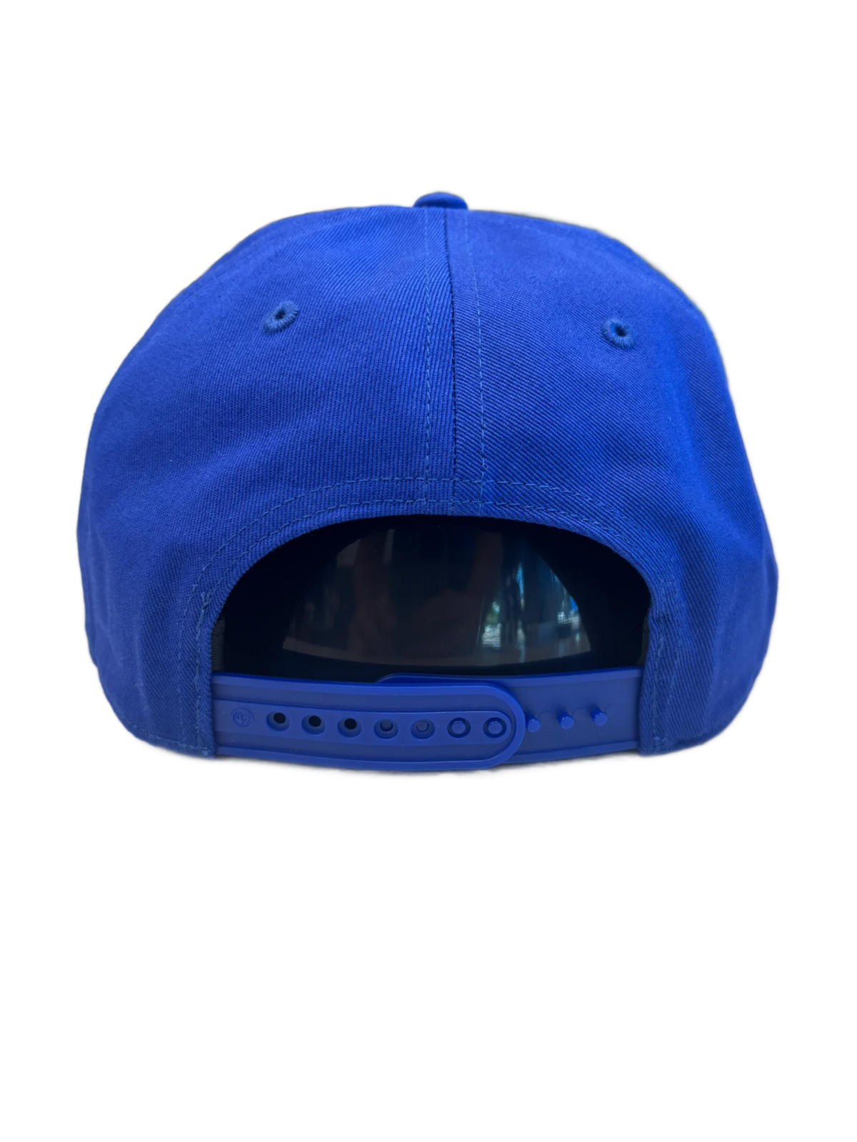 Blue cap with a reflective back on a white background